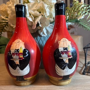 Set of oil and vinegar pourers in red ceremony with hand painted waiter design