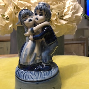 Delft hugging boy and girl