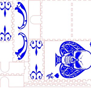 May include: A blue and white laser cut design of a skull inside a spade playing card. The design is intricate and detailed, with a skull face and a spade shape with swirls.