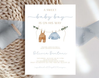 May include: A baby shower invitation with a watercolor illustration of a clothesline with two baby clothes hanging on it. The text reads "A Sweet Baby Boy Is On His Way" and includes the name "Olivia Bentoni", the date and time of the shower, and the location. The invitation also includes the RSVP information and the registry information.