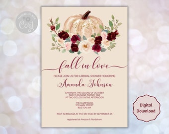 May include: A beige bridal shower invitation featuring a watercolour pumpkin and floral design. The text reads "fall in love" and includes event details, such as the date, time, and location. A "Digital Download" badge is in the lower right corner.