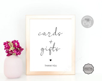 May include: A printable sign with a gold frame that says "cards + gifts" in black cursive font. The sign also includes the text "Thank You" and a small heart.