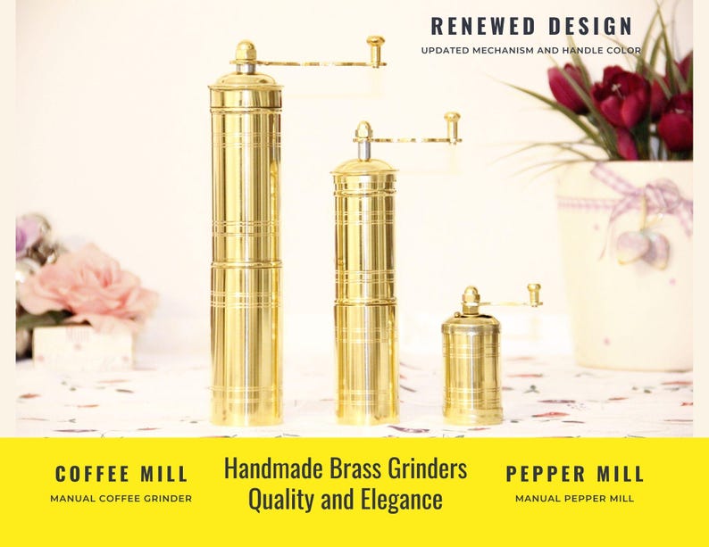 May include: Three brass coffee and pepper mills of varying sizes. The mills have a cylindrical shape with horizontal grooves and a hand crank. The text "RENEWED DESIGN" and "Handmade Brass Grinders Quality and Elegance" are visible.