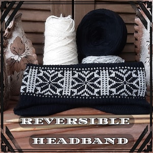 May include: A reversible black and white headband with a snowflake pattern. The headband is knitted and has a textured look. The text "REVERSIBLE HEADBAND" is printed below the headband.