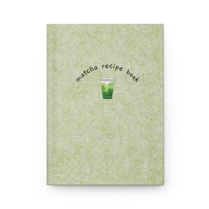 May include: A recipe book with a light green textured cover. The cover features the words "matcha recipe book" in a curved font, and an illustration of a matcha drink.