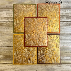 May include: Five cards with a gold foil embossed design of leaves and acorns. The cards are arranged in a row, with the top card labeled "Rose Gold Foil".