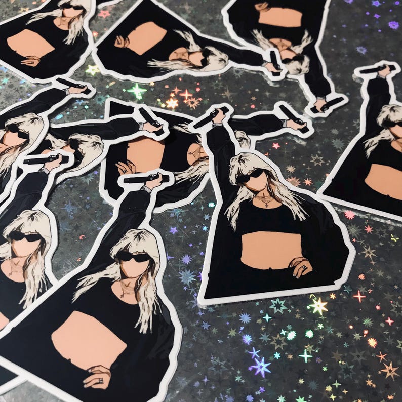 May include: Multiple stickers featuring a woman with blonde hair wearing a black crop top and sunglasses, holding a microphone. The stickers are on a glittery background.