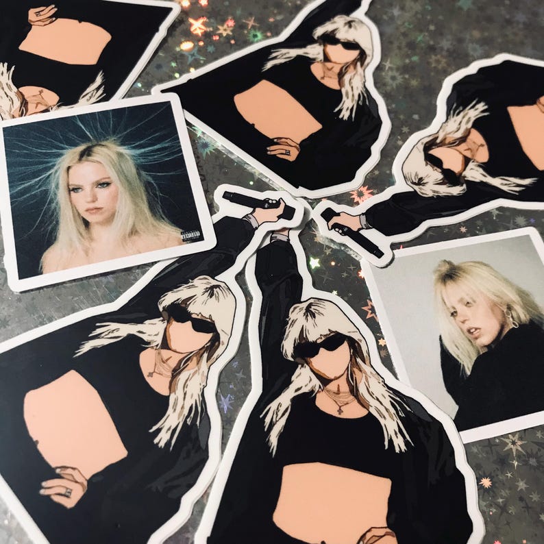 May include: A set of stickers featuring a woman with blonde hair wearing a black crop top and sunglasses. The stickers are printed on white paper and have a glossy finish.