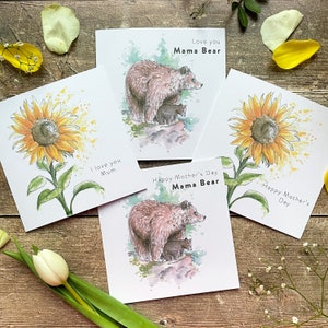 May include: Four greeting cards with watercolor illustrations of sunflowers and bears. The cards have different messages, including "Love you Mama Bear", "Happy Mother's Day Mama Bear", "I love you Mum", and "Happy Mother's Day".