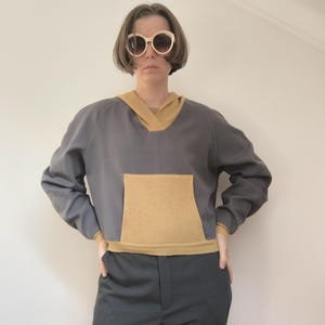 Upcycled hoodie reworked from second hand pullovers and textile waste, reworked hoodie, refashioned repurposed pullover, remade pullover