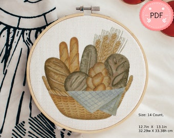 Könnte beinhalten: Ein Kreuzstichmuster eines Korbs gefüllt mit verschiedenen Broten, darunter Laib, Brötchen und Baguettes. Der Korb ist mit einem blau-weiß karierten Tuch ausgelegt. Das Muster ist 12,7 Zoll mal 13,1 Zoll groß, das sind 32,29 cm mal 33,38 cm, und hat 14 Zählfäden.