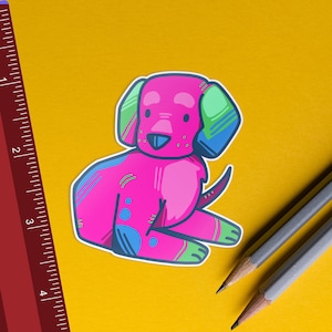May include: A pink, green, and blue cartoon dog sticker with a white outline. The dog is sitting with its tongue sticking out.