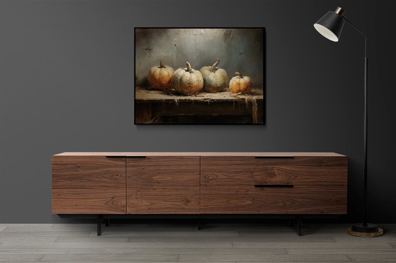 May include: A painting of four gourds on a wooden table. The gourds are a light brown color with a white, textured surface. The background is a light gray with a textured surface.