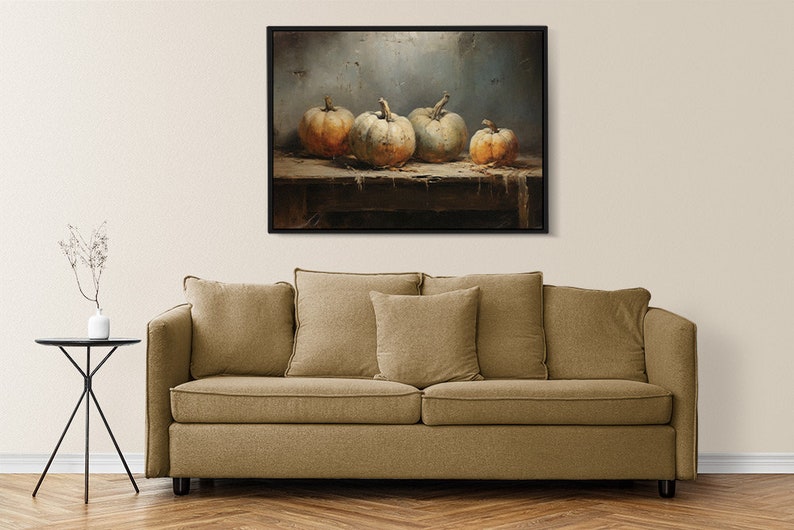 May include: A painting of four gourds on a wooden table. The gourds are various shades of white and orange. The background is a muted blue.
