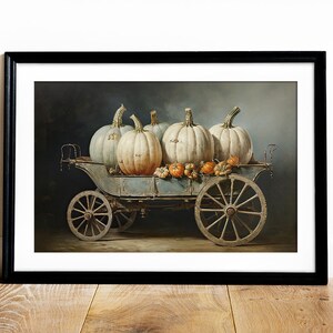 May include: A vintage-style wagon filled with white and blue pumpkins. The wagon has wooden wheels and a blue painted body. The pumpkins are arranged in a pile, with some smaller pumpkins and gourds scattered around them.