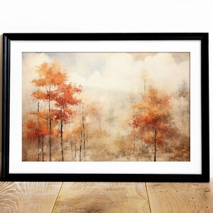 May include: A framed watercolor painting of a forest scene with trees in shades of orange, brown, and yellow. The trees are surrounded by a hazy, atmospheric background.
