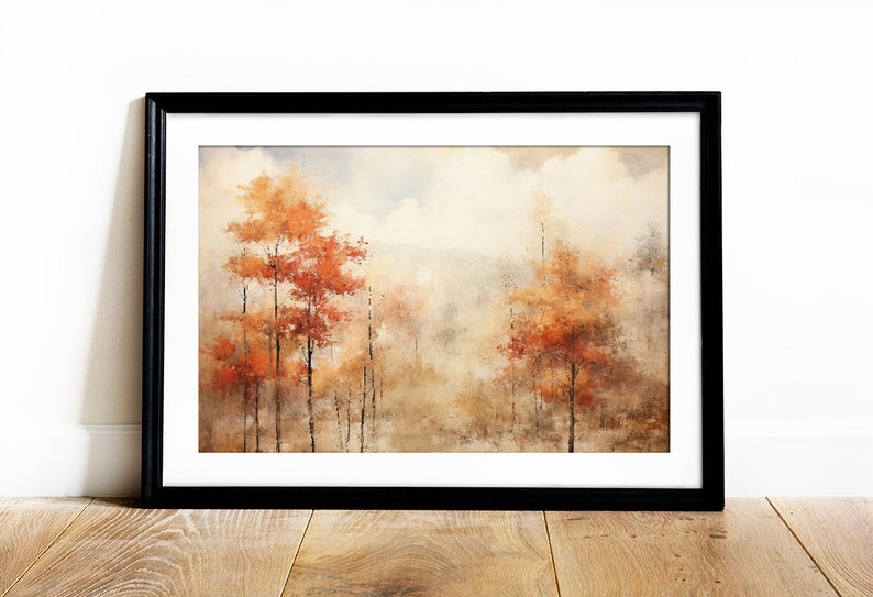 May include: A framed watercolor painting of a forest scene with trees in shades of orange, brown, and yellow. The trees are surrounded by a hazy, atmospheric background.