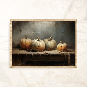 May include: A still life painting of four pumpkins on a wooden table. The pumpkins are various shades of white and orange. The background is a textured, gray wall.