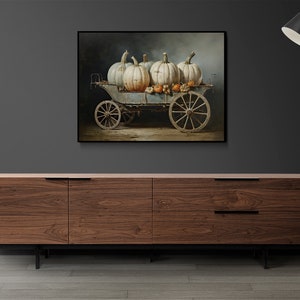 May include: A painting of a vintage wagon filled with white pumpkins and smaller orange pumpkins. The wagon is on a dirt road with a dark background.