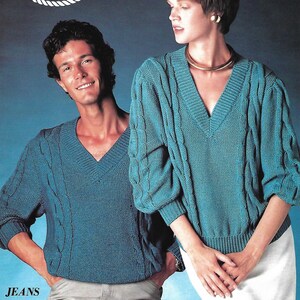 May include: A teal V-neck sweater with cable knit detailing is worn by a man and a woman. The image is from a vintage fashion pamphlet. The text "di.ve" is at the top, and "JEANS Pamphlet 304" is at the bottom.