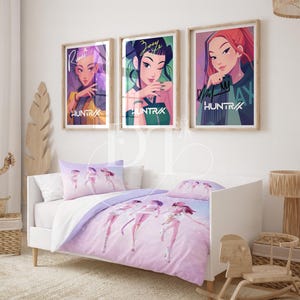 May include: A bedroom scene featuring a white bed with a purple and white comforter set and matching pillowcases. Above the bed are three framed art prints with stylized portraits. The prints feature the text "HUNTRAX".