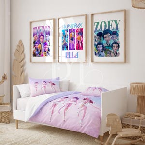 May include: A child's bedroom with a white bed featuring a purple and white comforter set with a character design. Above the bed are three framed posters with character art. The room has a neutral color palette with a wooden accent.