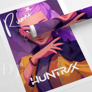 May include: A rolled poster featuring a digital illustration of a person with purple hair and a yellow jacket. The artwork includes the text "Rumi" and "HUNTR/X" in white. The color palette is dominated by purple, yellow, and orange.