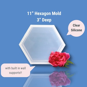 May include: Clear silicone hexagon mould, 11 inches wide and 3 inches deep. The mould has built-in wall supports.