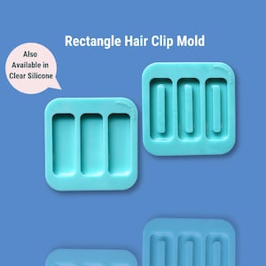Peut inclure: Deux moules à barrettes rectangulaires turquoise. Chaque moule comporte trois fentes rectangulaires. Le texte "Rectangle Hair Clip Mold" est en haut. Le texte "Also Available in Clear Silicone" est dans une bulle.