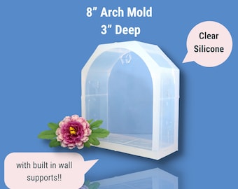May include: Clear silicone mold for crafting, shaped like an arch with a 8 inch opening and 3 inch depth. The mold has built-in wall supports.