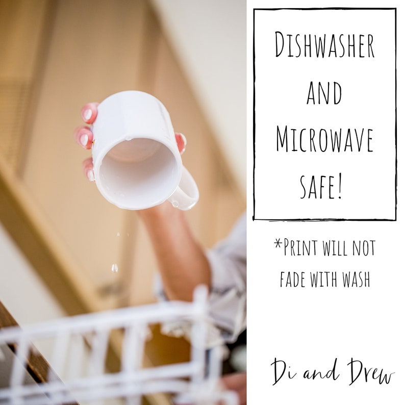 May include: A white ceramic mug with a handle, being held by a hand. The mug is dripping water, suggesting it has been washed. The text "DISHWASHER AND MICROWAVE SAFE! *PRINT WILL NOT FADE WITH WASH Di and Drew" is visible in the background.