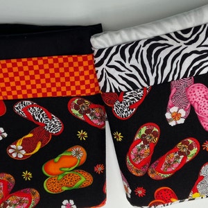 Sale Items . Single standard pillowcases in zebra and white  or red /orange check and black. Flip flop design.  Slight  flaws in fabric  .