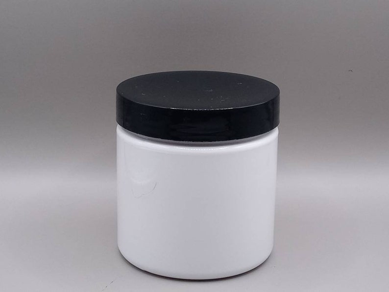 May include: A white plastic jar with a black lid. The jar is empty and ready to be filled with your favourite product.