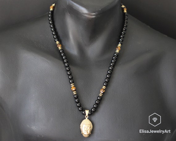 Pierre de protection l'oeil de tigre est en collier pendentif cage