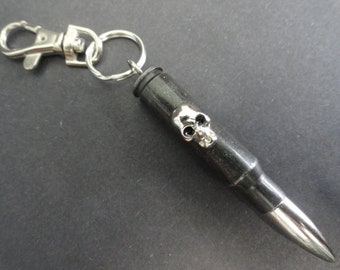 Key chain with real .308 caliber bullet and skull head stud
