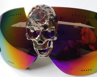 Iridescent ski goggles with centered skull and crystal brain