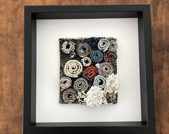 10x10in Box Framed, Rolled Rug Art.  Spools of antique rug fragments.  Unique, one-of-a-kind Wall Decor.