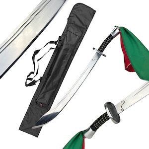 May include: A silver-colored sword with a black handle and a green and red flag attached to the tip. The sword is in a black nylon scabbard with a shoulder strap.