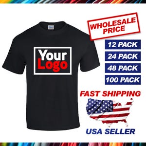 May include: Black t-shirt with a white rectangle that says "Your Logo" in red letters. The t-shirt is available in bulk packs of 12, 24, 48, and 100. Fast shipping and USA seller.