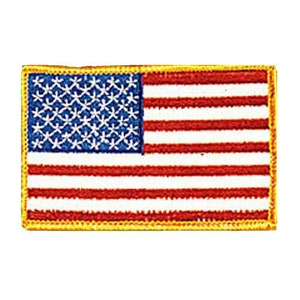 May include: A small embroidered American flag patch with a yellow border. The flag has 13 red and white stripes and a blue field with 50 white stars.