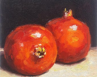 May include: Oil painting of two ripe pomegranates. The pomegranates are a vibrant red-orange color, with textured brushstrokes. The background is a dark, solid color, and the pomegranates are resting on a light-colored surface.