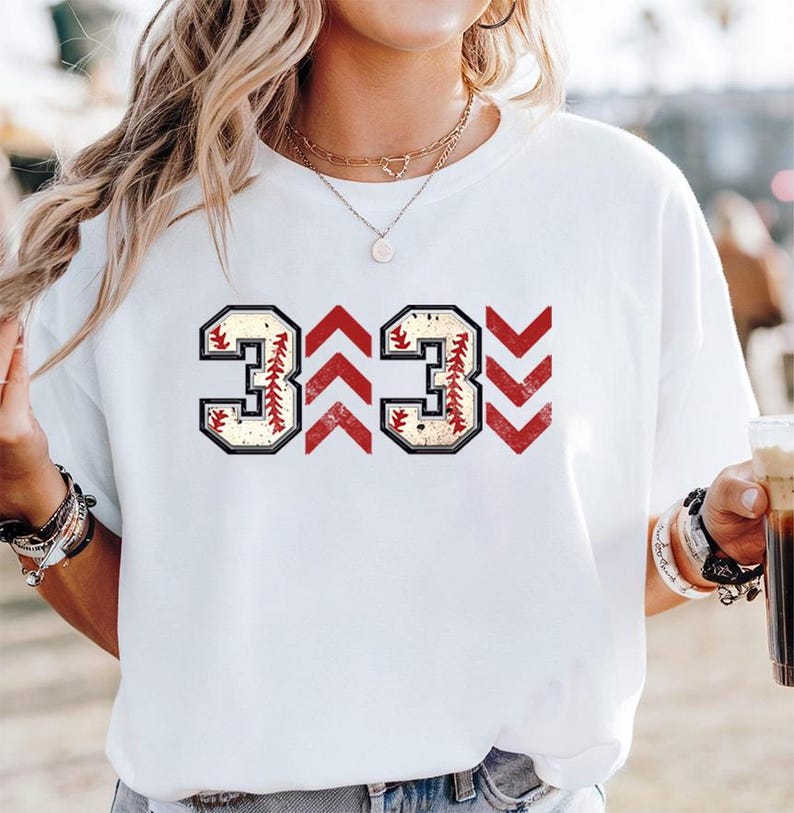 Baseball graphic shirt featuring the phrase 3 Up 3 Down displayed in bold distressed numbers with directional arrow accents; athletic-inspired typography arranged in a centered layout that reflects classic baseball scoreboard style; clean sports design created for fans players and game day wear