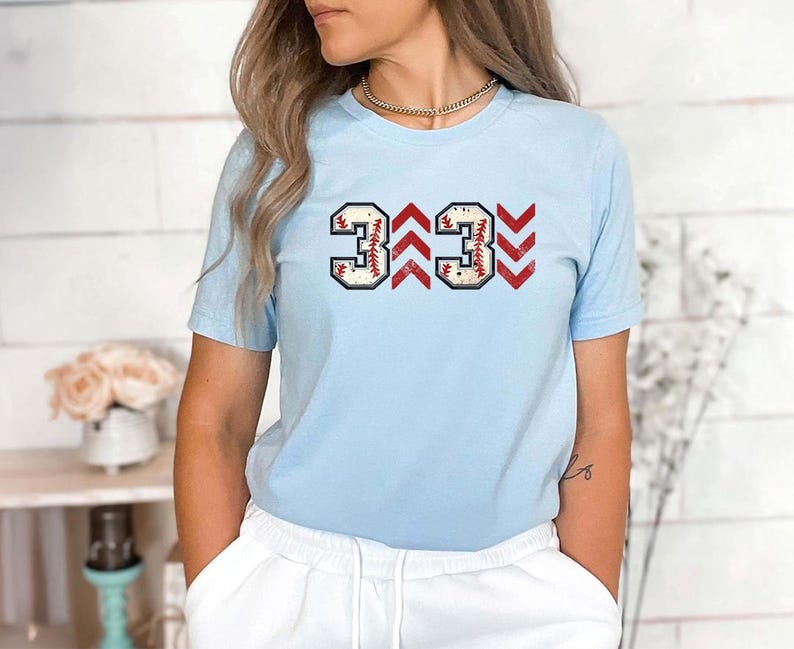 Baseball graphic shirt featuring the phrase 3 Up 3 Down displayed in bold distressed numbers with directional arrow accents; athletic-inspired typography arranged in a centered layout that reflects classic baseball scoreboard style; clean sports design created for fans players and game day wear