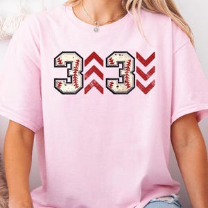 Baseball graphic shirt featuring the phrase 3 Up 3 Down displayed in bold distressed numbers with directional arrow accents; athletic-inspired typography arranged in a centered layout that reflects classic baseball scoreboard style; clean sports design created for fans players and game day wear