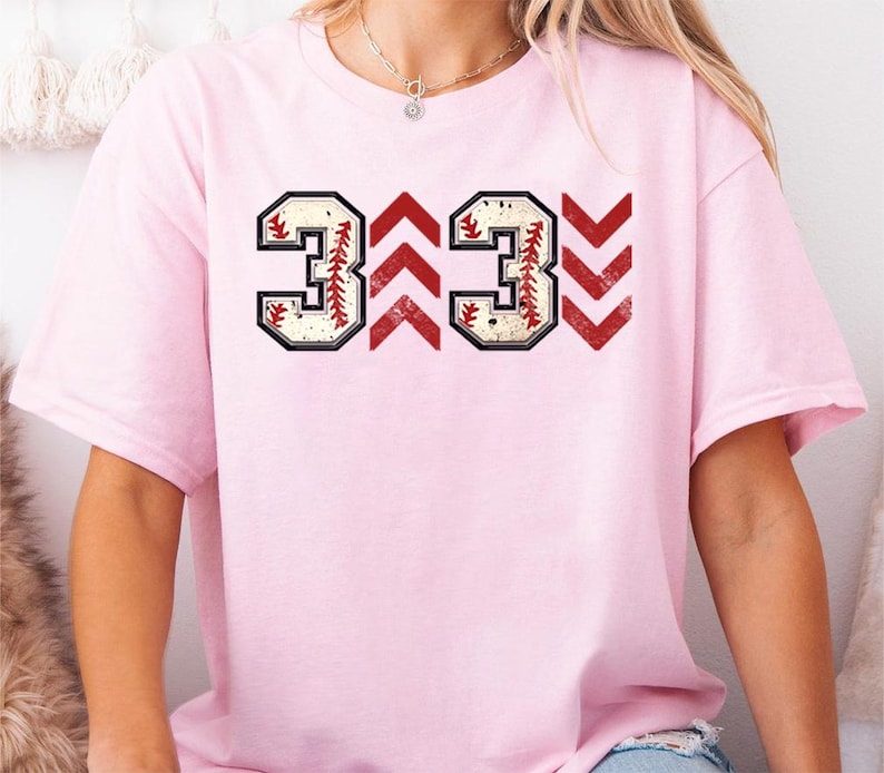 Baseball graphic shirt featuring the phrase 3 Up 3 Down displayed in bold distressed numbers with directional arrow accents; athletic-inspired typography arranged in a centered layout that reflects classic baseball scoreboard style; clean sports design created for fans players and game day wear