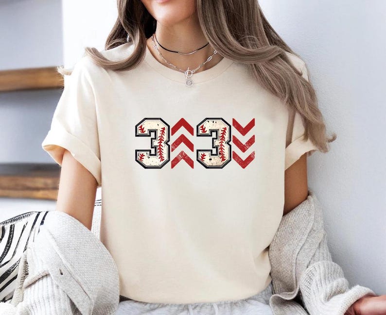 Baseball graphic shirt featuring the phrase 3 Up 3 Down displayed in bold distressed numbers with directional arrow accents; athletic-inspired typography arranged in a centered layout that reflects classic baseball scoreboard style; clean sports design created for fans players and game day wear