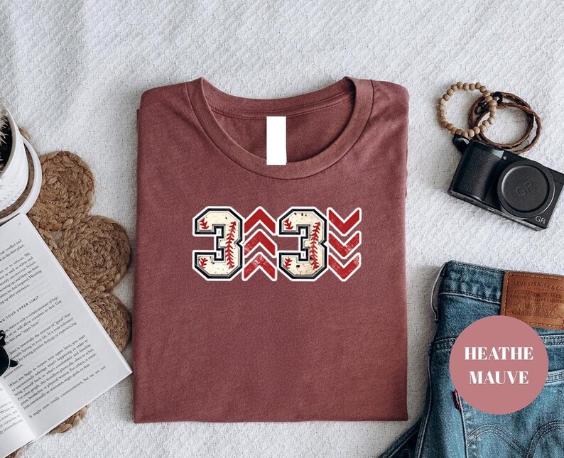 Baseball graphic shirt featuring the phrase 3 Up 3 Down displayed in bold distressed numbers with directional arrow accents; athletic-inspired typography arranged in a centered layout that reflects classic baseball scoreboard style; clean sports design created for fans players and game day wear