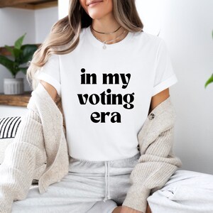 In My Voting Era Shirt Funny Anti Trump Joe Biden Democrat Trump Sucks 2024 Election Democrat Feminist Fuck The Patriarchy WHITE/BLACK