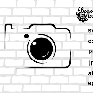 Pode incluir: Esboço preto e branco de uma câmera com um círculo para a lente. A câmera está em um fundo de tijolos brancos.