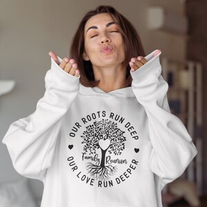 May include: White hoodie with a black tree design and the text "Our roots run deep, our love run deeper, Family Reunion".